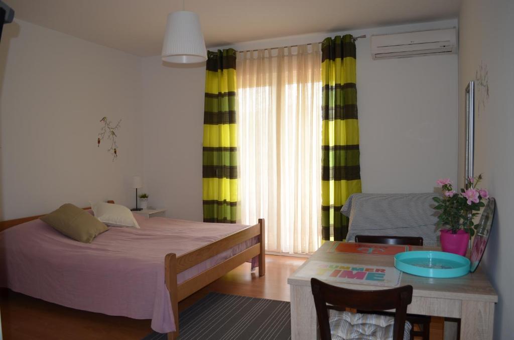 Postel nebo postele na pokoji v ubytování Apartments Mili