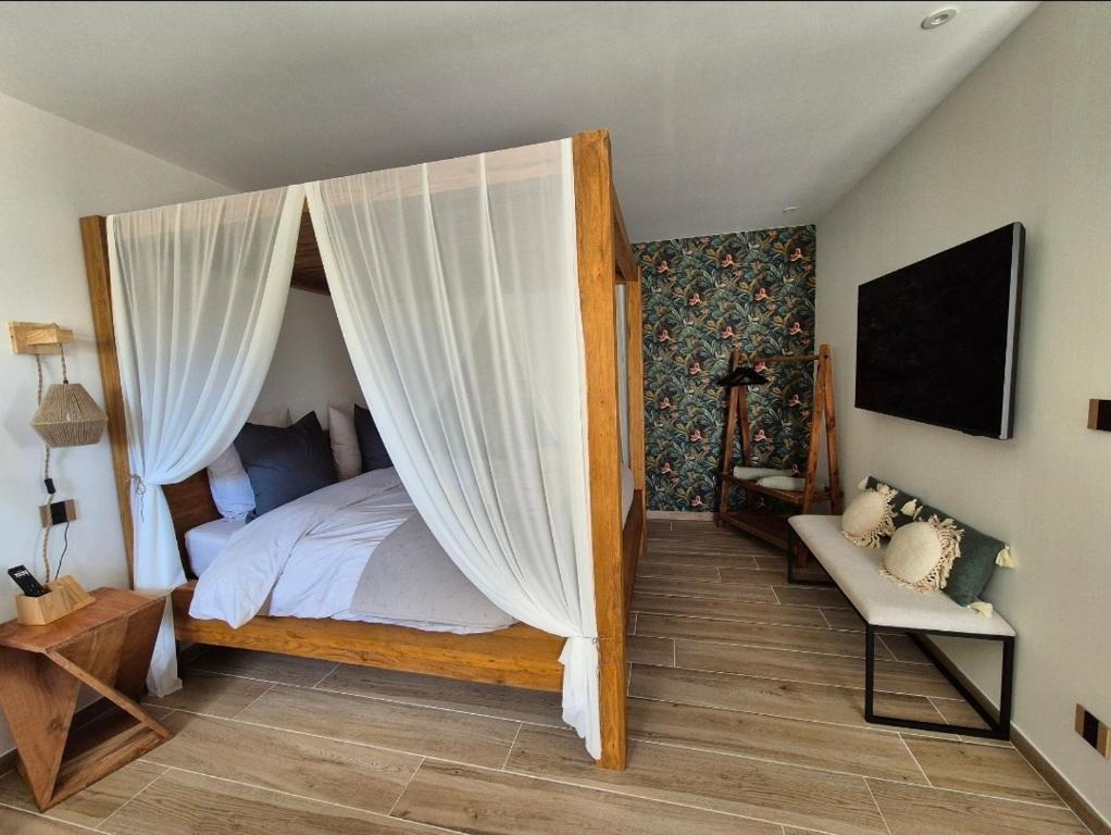 Postel nebo postele na pokoji v ubytování Le Cocoon - Jacuzzi, Sauna et Piscine privée