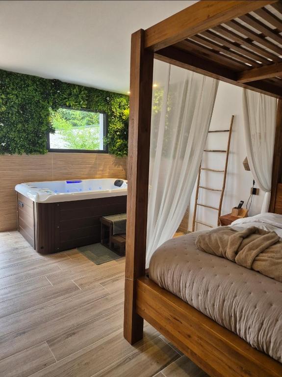 Postel nebo postele na pokoji v ubytování Le Cocoon - Jacuzzi, Sauna et Piscine privée