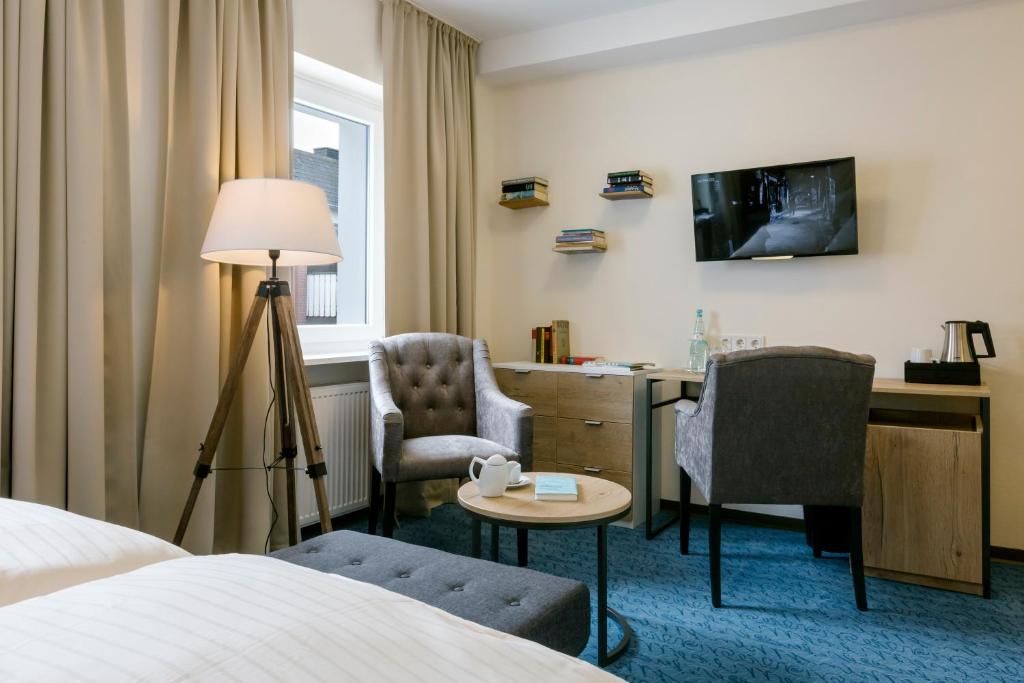 Postel nebo postele na pokoji v ubytování Hotel auf den Hummerklippen