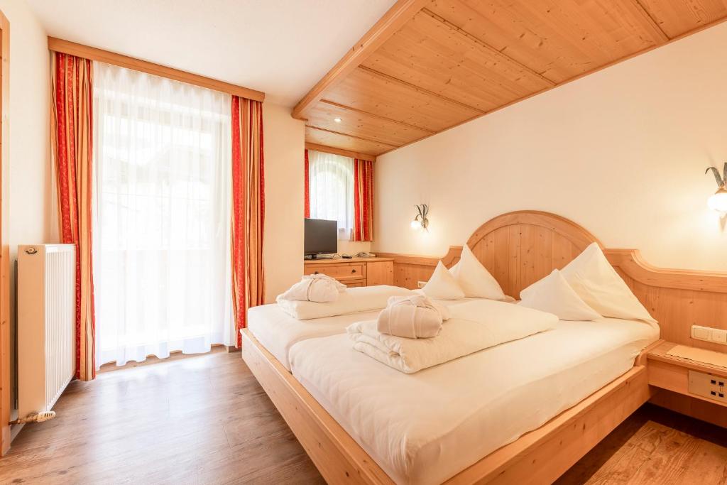 Postel nebo postele na pokoji v ubytování Alpenpension Pfurtscheller