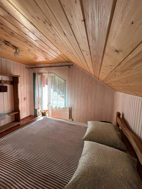 Postel nebo postele na pokoji v ubytování Садиба Кичера