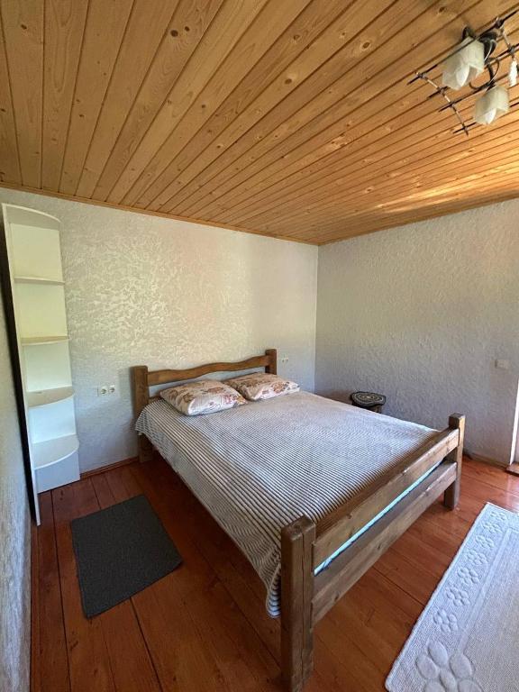 Postel nebo postele na pokoji v ubytování Садиба Кичера