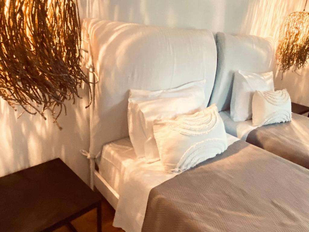 Postel nebo postele na pokoji v ubytování Le Blanc