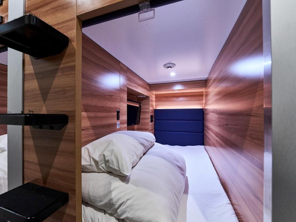 Postel nebo postele na pokoji v ubytování Livemax Resort Sanuki Shionoe Onsen