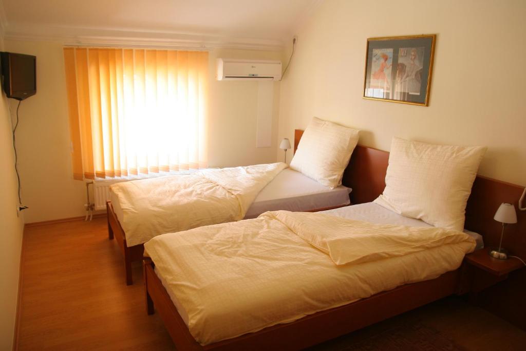Postel nebo postele na pokoji v ubytování Konak Požarevac