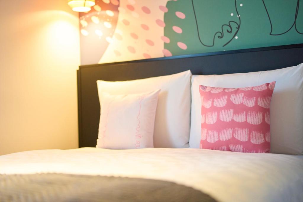 Postel nebo postele na pokoji v ubytování Hotel Resol Ueno