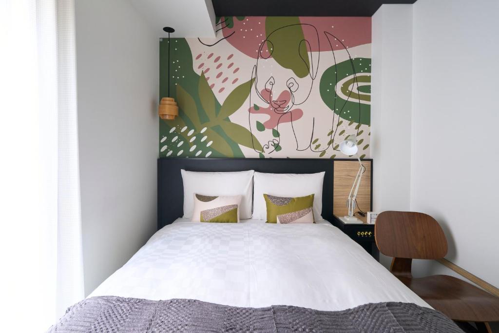 Postel nebo postele na pokoji v ubytování Hotel Resol Ueno
