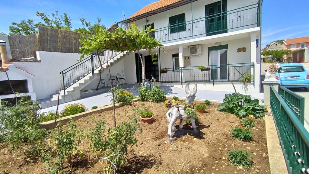 an aerial view of a garden in front of a house at Holiday Home Nikola in Skradin
