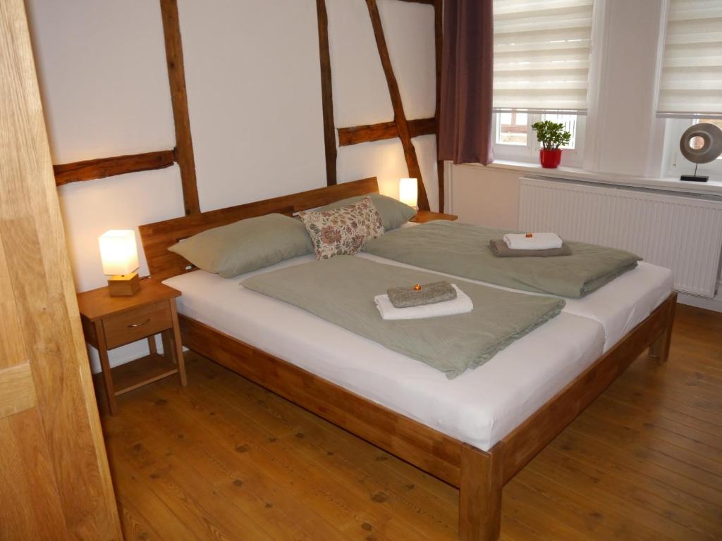 a bedroom with a bed with two towels on it at Haus-Wolter in Goslar