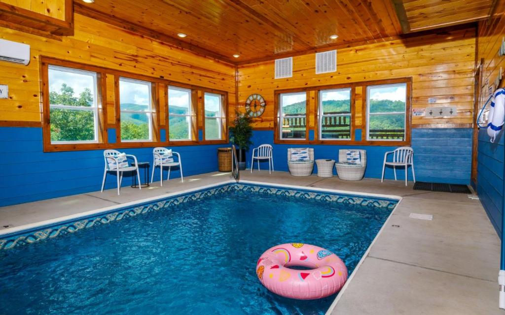 a swimming pool with a donut in a house at Dip in the Smokies in Gatlinburg