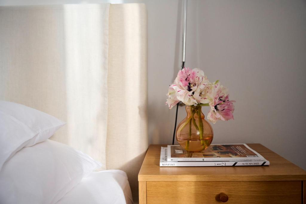 Postel nebo postele na pokoji v ubytování Hotel Haus Norderney