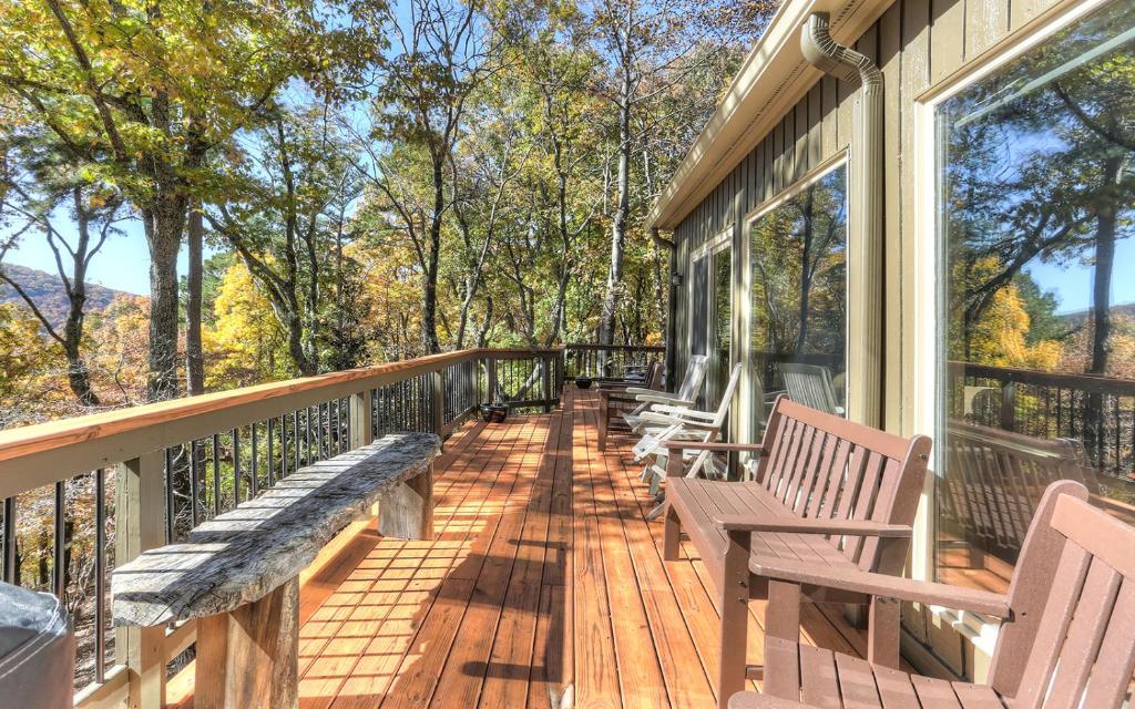 a porch with benches on the side of a house at Vista Haven - Mountain Views and Fireplace and Big Screen TVs and Extras in Jasper
