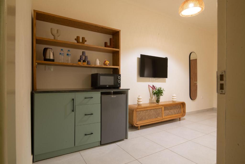 Kuchyň nebo kuchyňský kout v ubytování Ios Hotel & Village