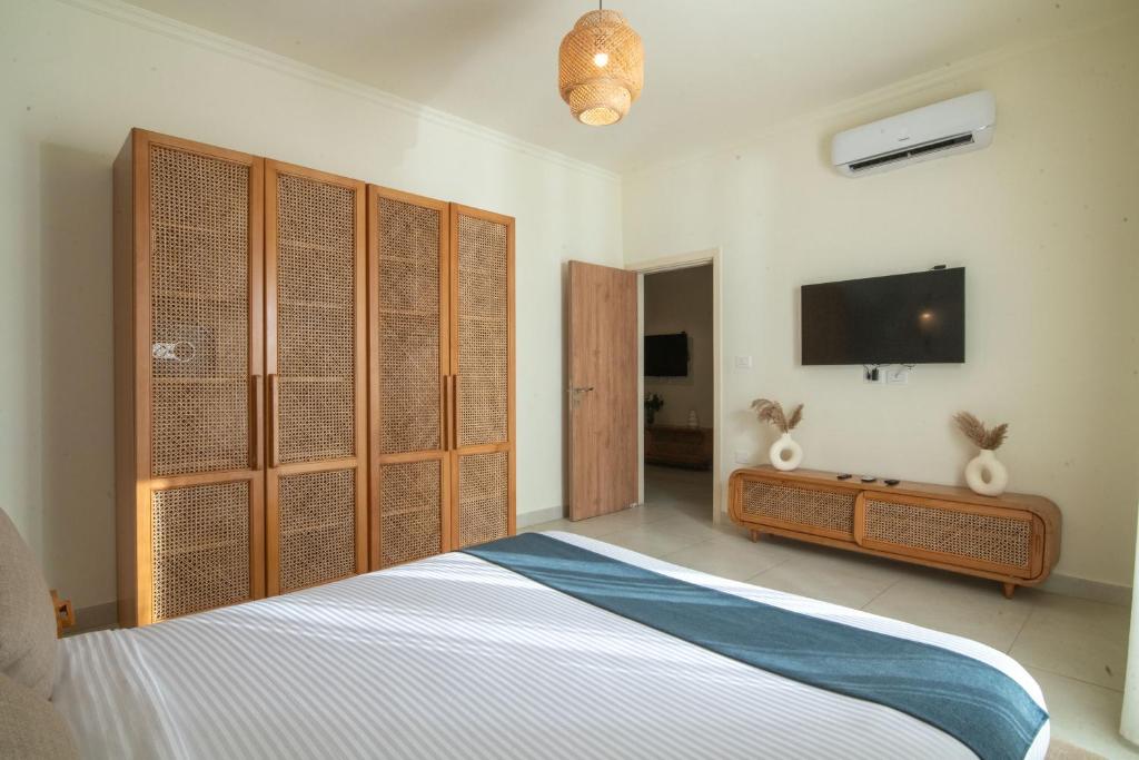 Postel nebo postele na pokoji v ubytování Ios Hotel & Village