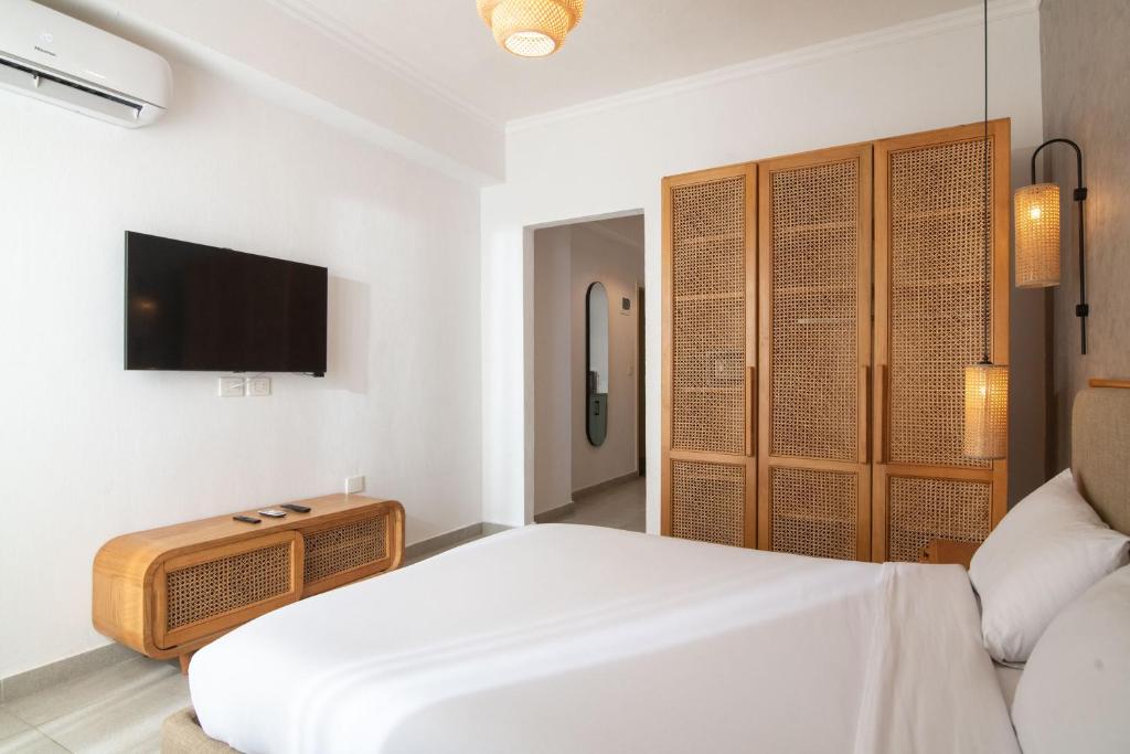 TV a/nebo společenská místnost v ubytování Ios Hotel & Village