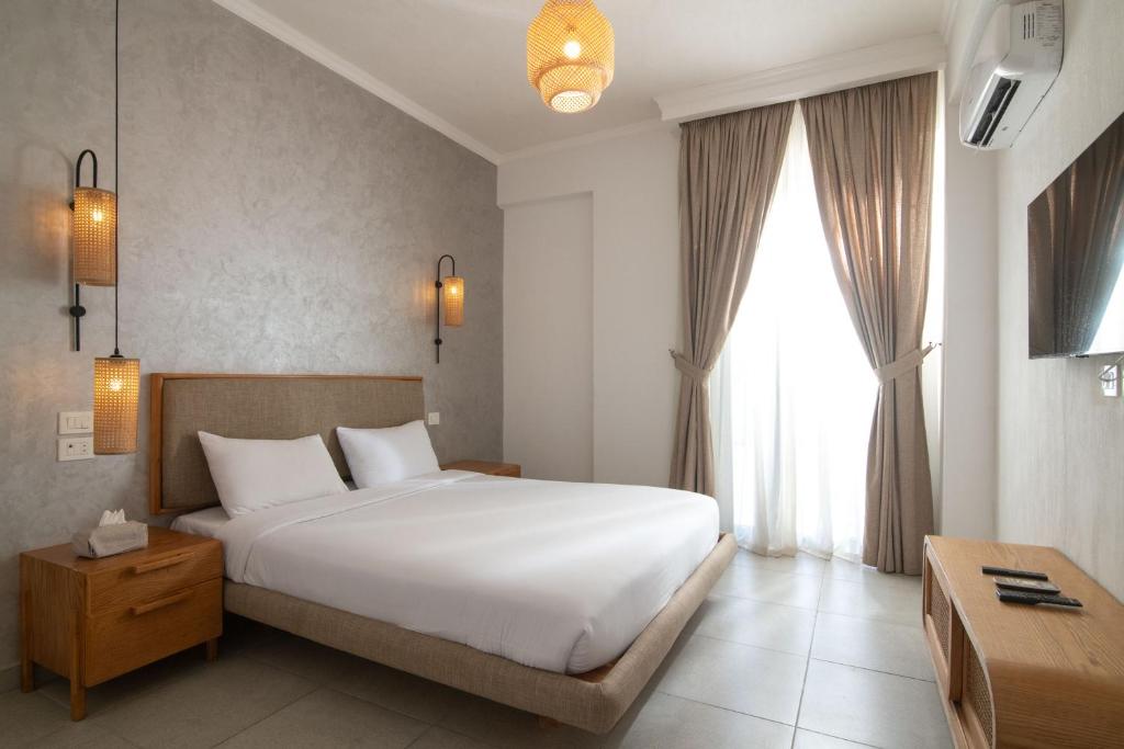 Postel nebo postele na pokoji v ubytování Ios Hotel & Village