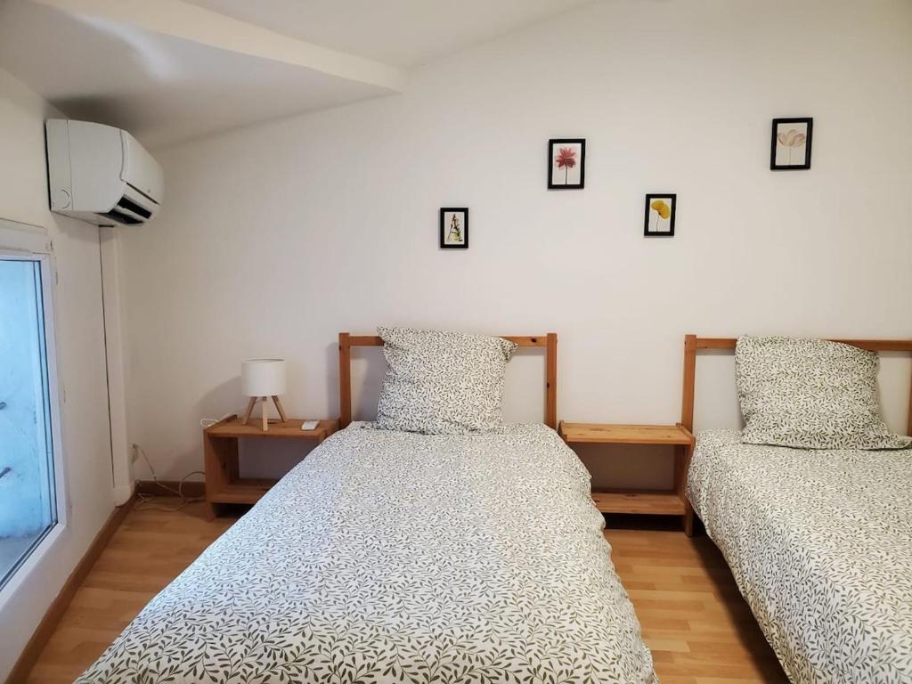 Ένα ή περισσότερα κρεβάτια σε δωμάτιο στο Séjour cosy proche mer