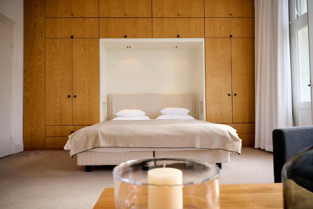 Postel nebo postele na pokoji v ubytování Hotel Haus Norderney