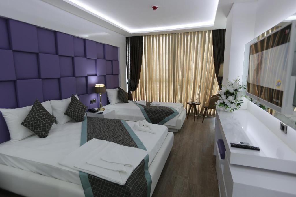 Postel nebo postele na pokoji v ubytování Elips Royal Hotel & SPA