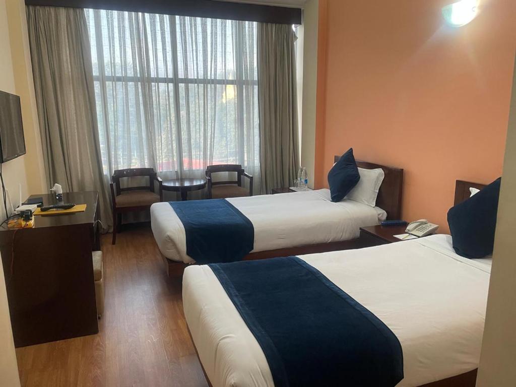Postel nebo postele na pokoji v ubytování Airport Hotel