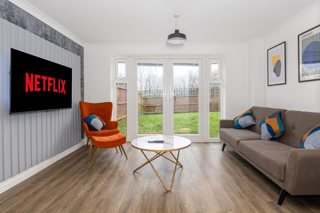 a living room with a couch and a table at Host & Stay - Bluebell Close in Northampton
