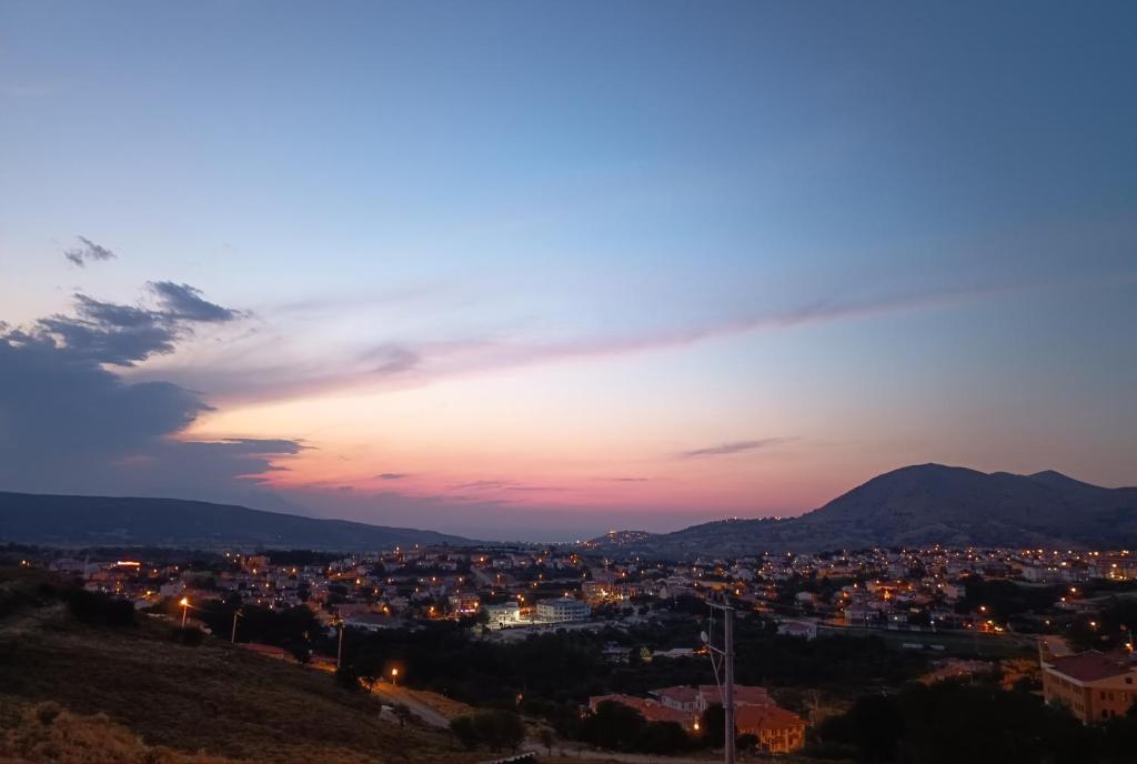 a view of a city at dusk at Duplex house with panoramic view in Gökçeada