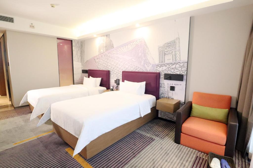 Postel nebo postele na pokoji v ubytování Hampton by Hilton Guangzhou Zhujiang New Town - Free Shuttle Bus to Canton Fair