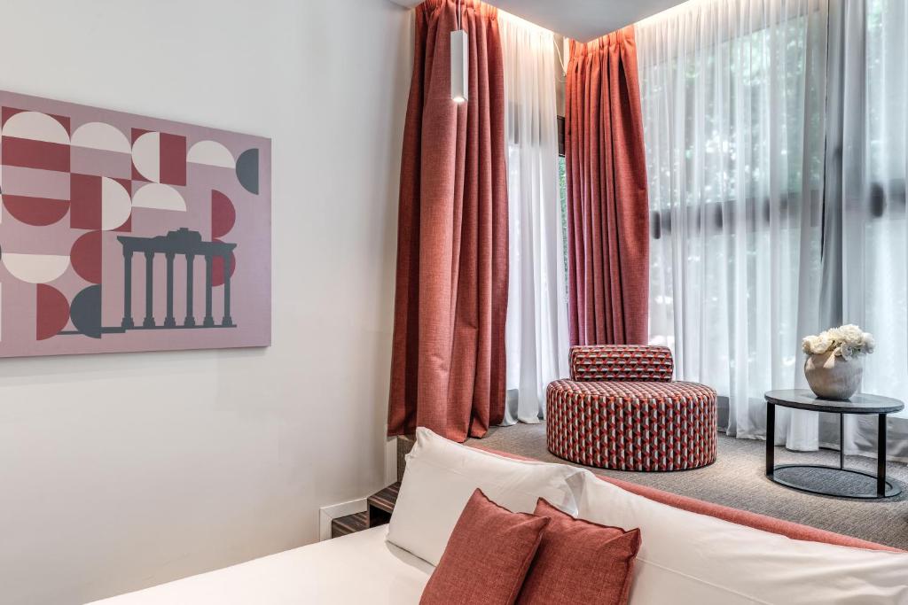 Postel nebo postele na pokoji v ubytování Parioli Cube Hotel