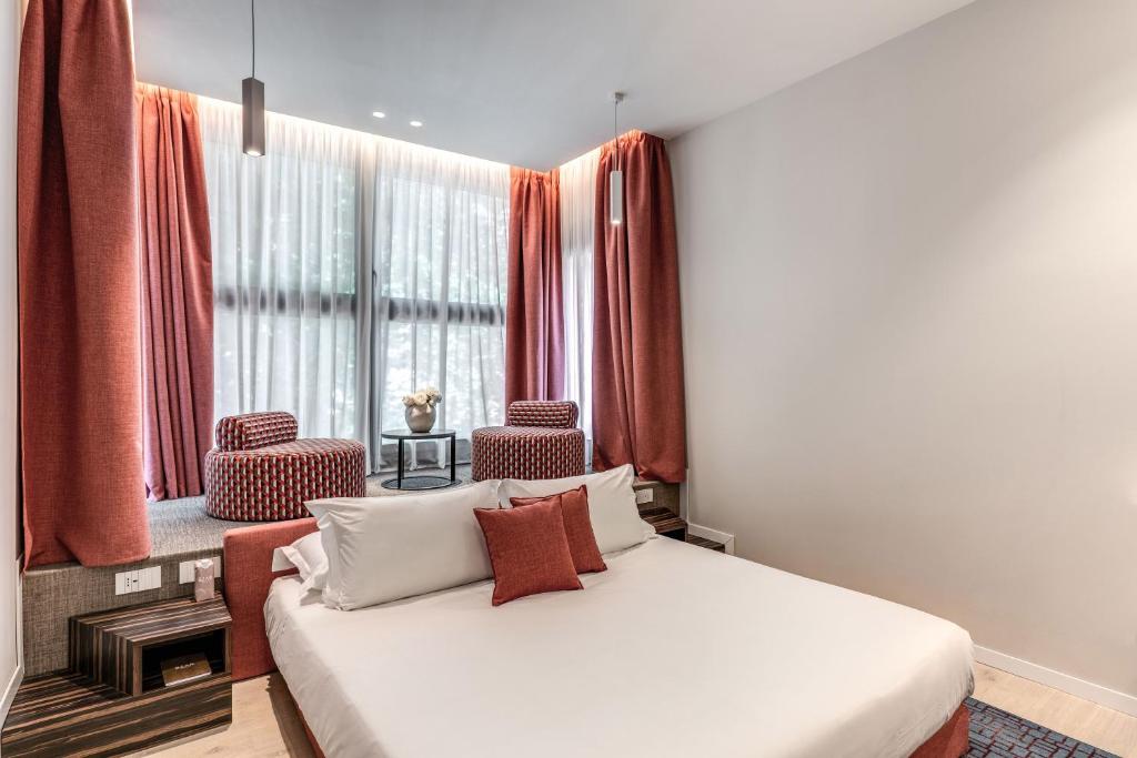 Postel nebo postele na pokoji v ubytování Parioli Cube Hotel