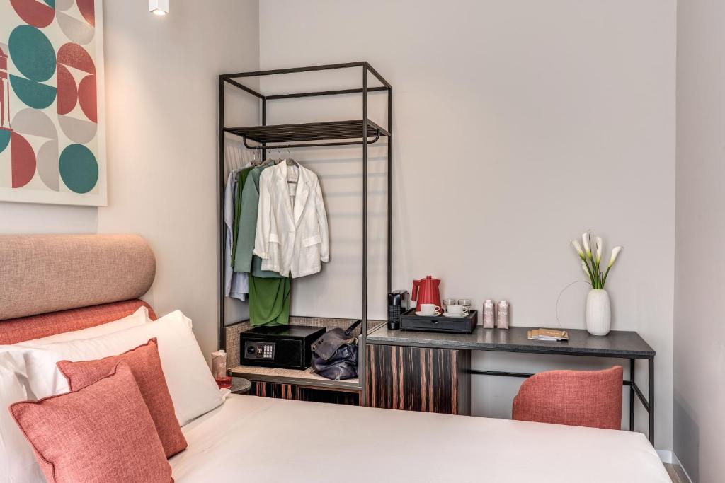 Postel nebo postele na pokoji v ubytování Parioli Cube Hotel