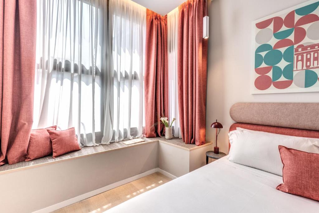Postel nebo postele na pokoji v ubytování Parioli Cube Hotel