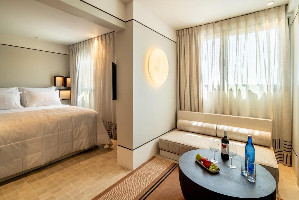 Postel nebo postele na pokoji v ubytování Daroma by Isrotel Collection