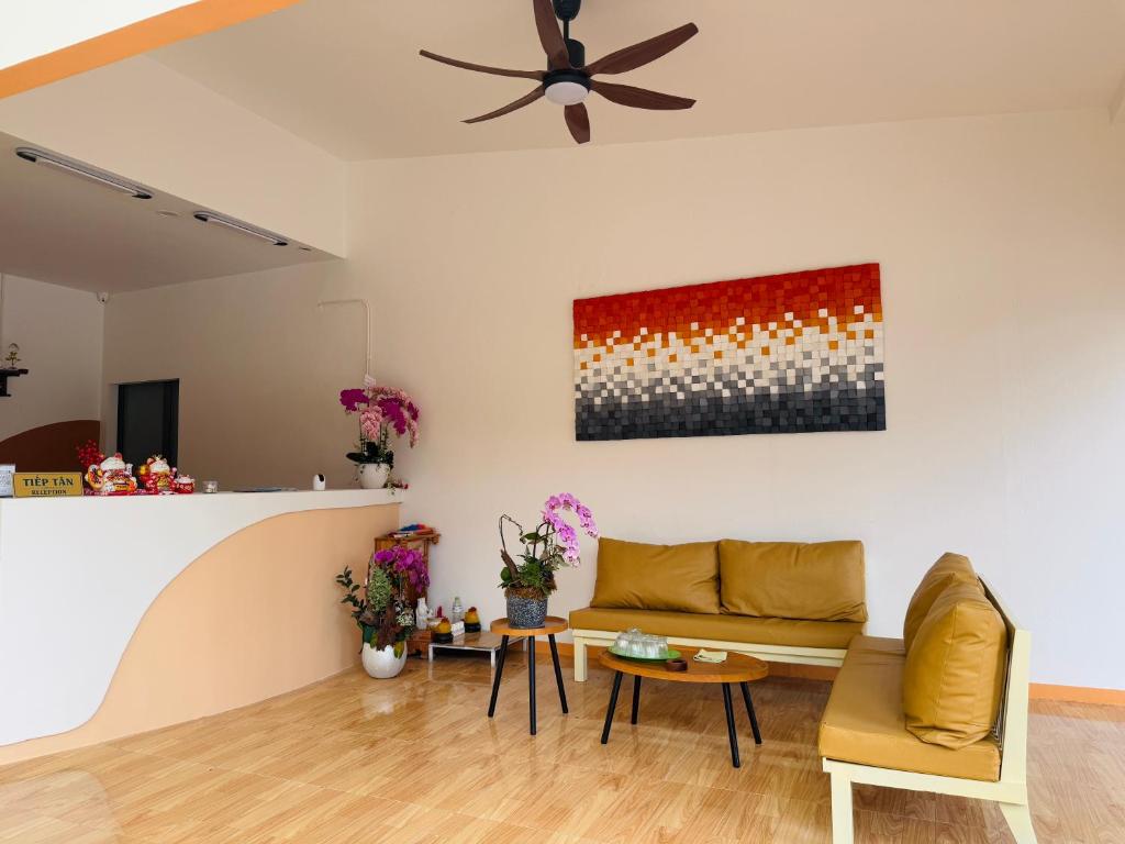 a living room with a couch and a table at Nos Vetra Resort in Phú Quốc