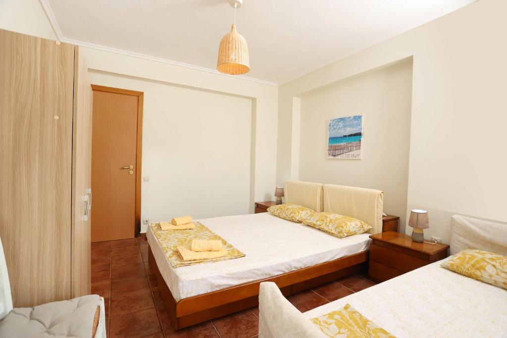 Voodi või voodid majutusasutuse Villa Sourouko toas