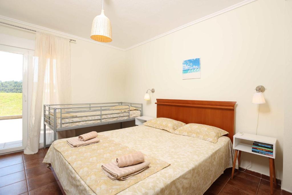 Letto o letti in una camera di Villa Sourouko