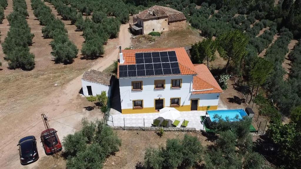 an aerial view of a house with solar panels on the roof at Casa rural Juan Pablo in Segura de la Sierra