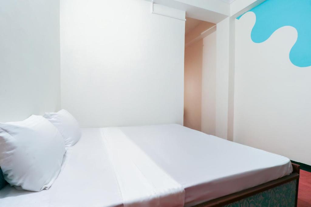 Postel nebo postele na pokoji v ubytování hotel dp bar and restaurent