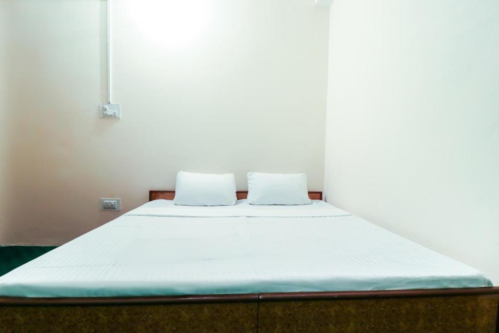 Postel nebo postele na pokoji v ubytování hotel dp bar and restaurent