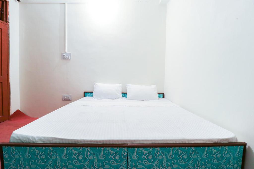Postel nebo postele na pokoji v ubytování hotel dp bar and restaurent