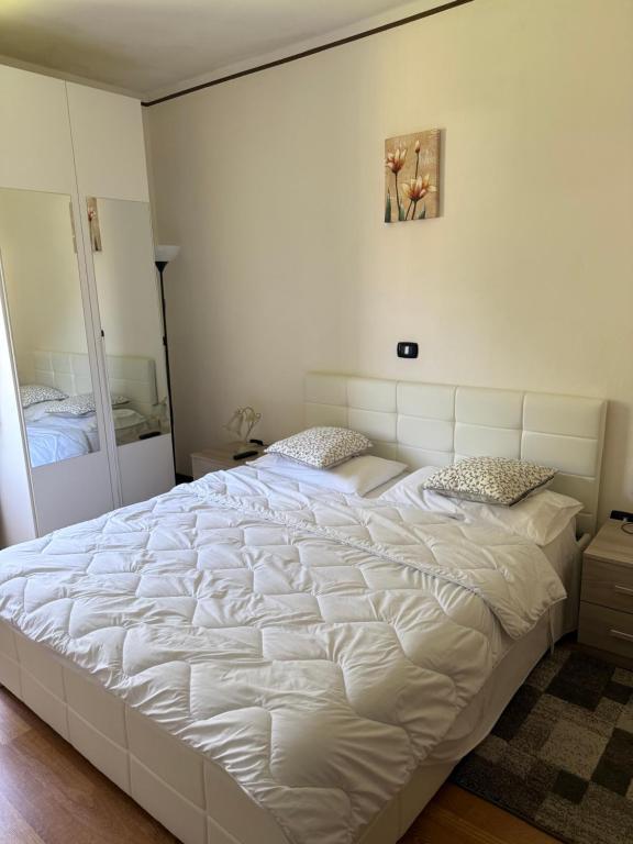 Postel nebo postele na pokoji v ubytování Albergo al lago