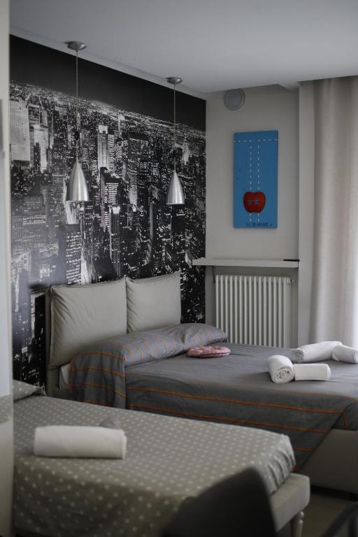 Postel nebo postele na pokoji v ubytování SMILE ACCOMODATION AOSTA