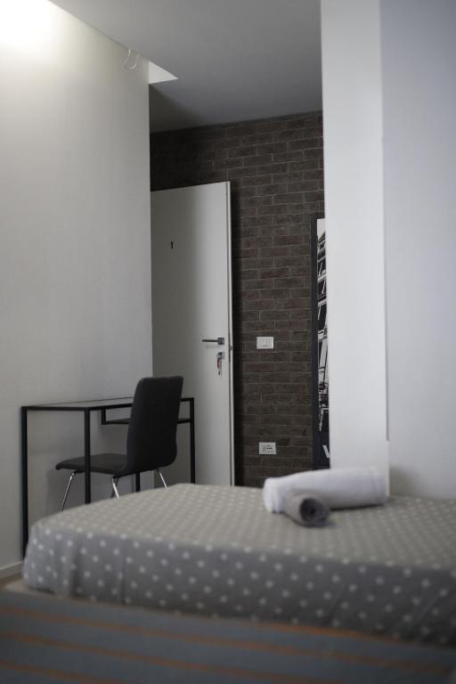 Postel nebo postele na pokoji v ubytování SMILE ACCOMODATION AOSTA