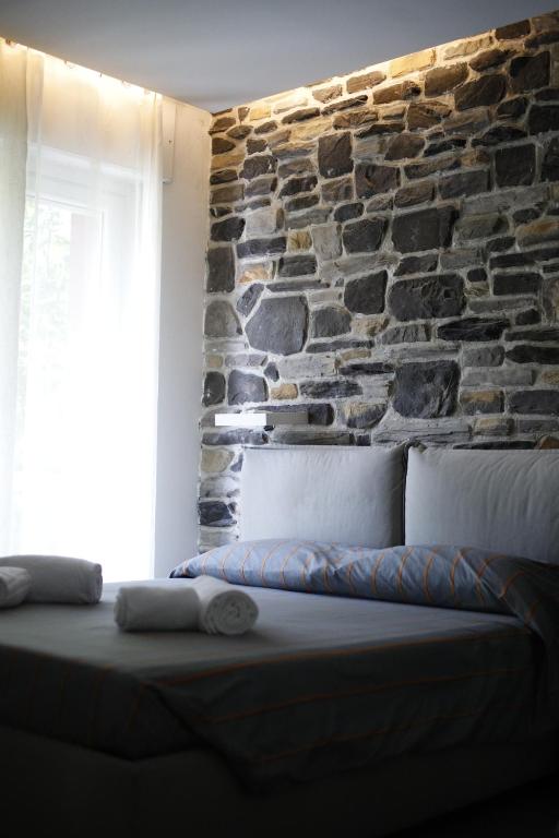 Postel nebo postele na pokoji v ubytování SMILE ACCOMODATION AOSTA
