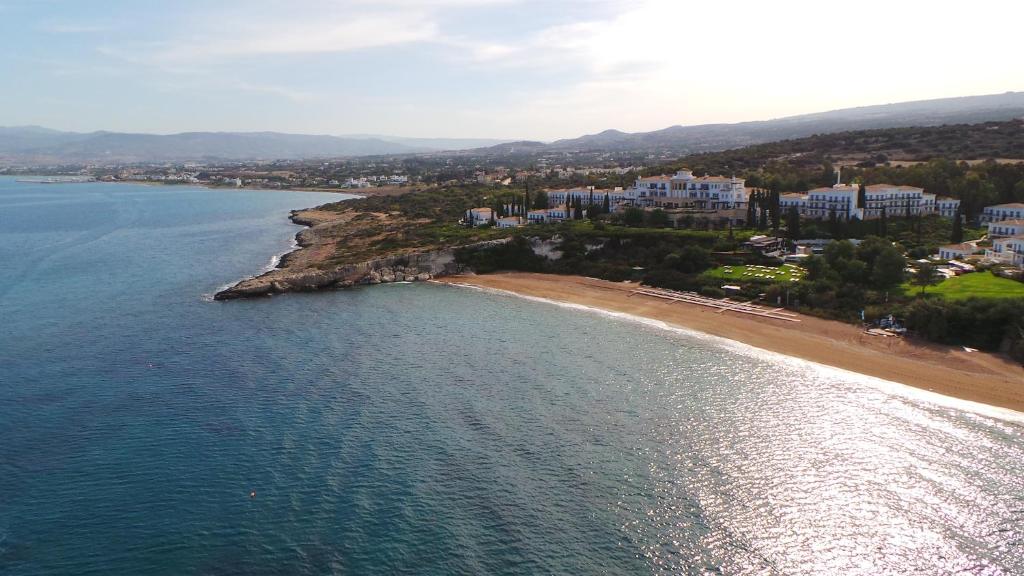 an aerial view of a beach and the ocean at Anassa in Polis Chrysochous
