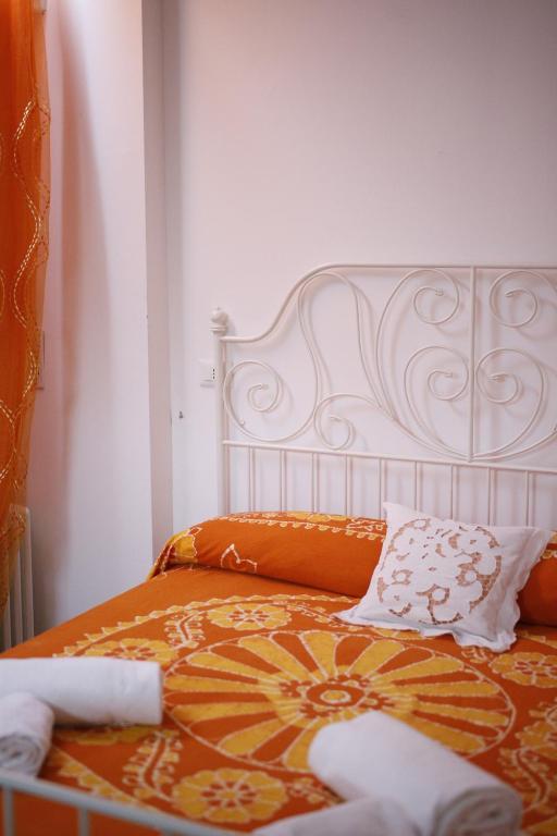 Postel nebo postele na pokoji v ubytování SMILE ACCOMODATION AOSTA