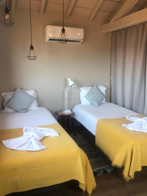 Ένα ή περισσότερα κρεβάτια σε δωμάτιο στο Casas Sebastião - Tourist House