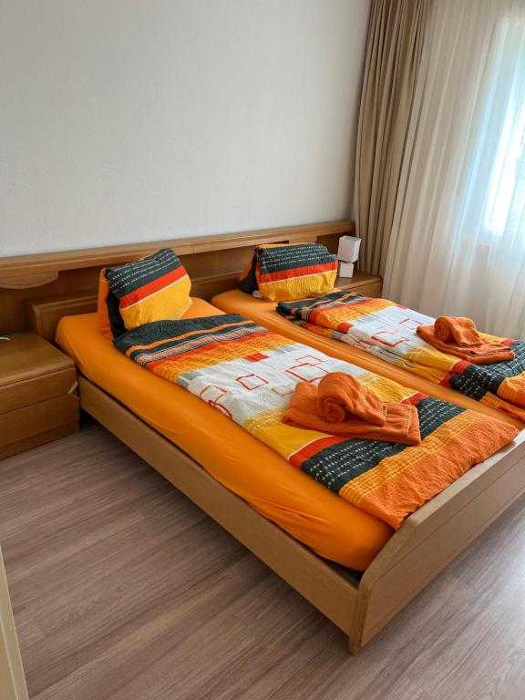 Postel nebo postele na pokoji v ubytování 2 Zimmerwohnung Haus Marmotta 26