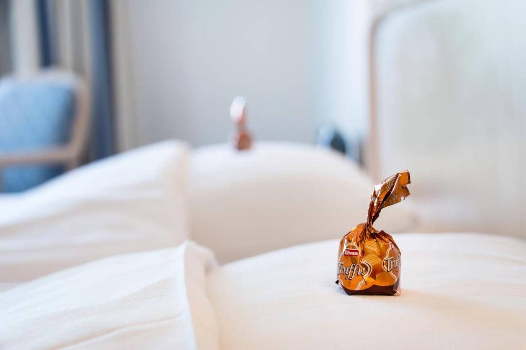 Postel nebo postele na pokoji v ubytování Hotel Mölndals Bro