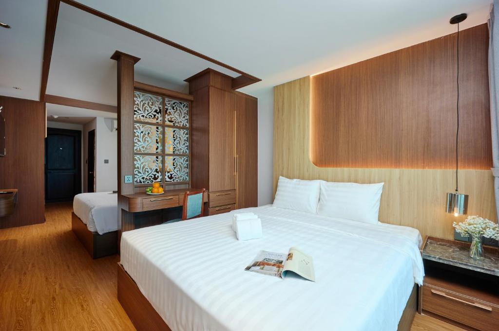 Postel nebo postele na pokoji v ubytování Elite Luxury Hotel
